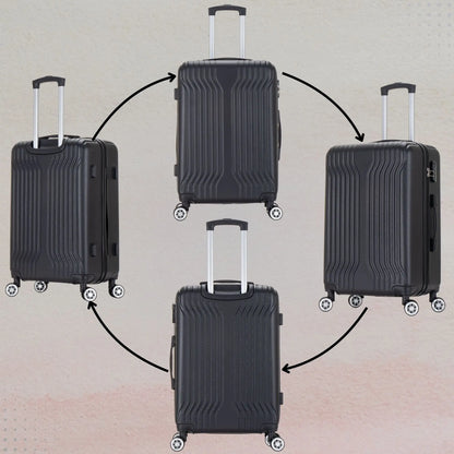Four black suitcases with wheels on a beige background