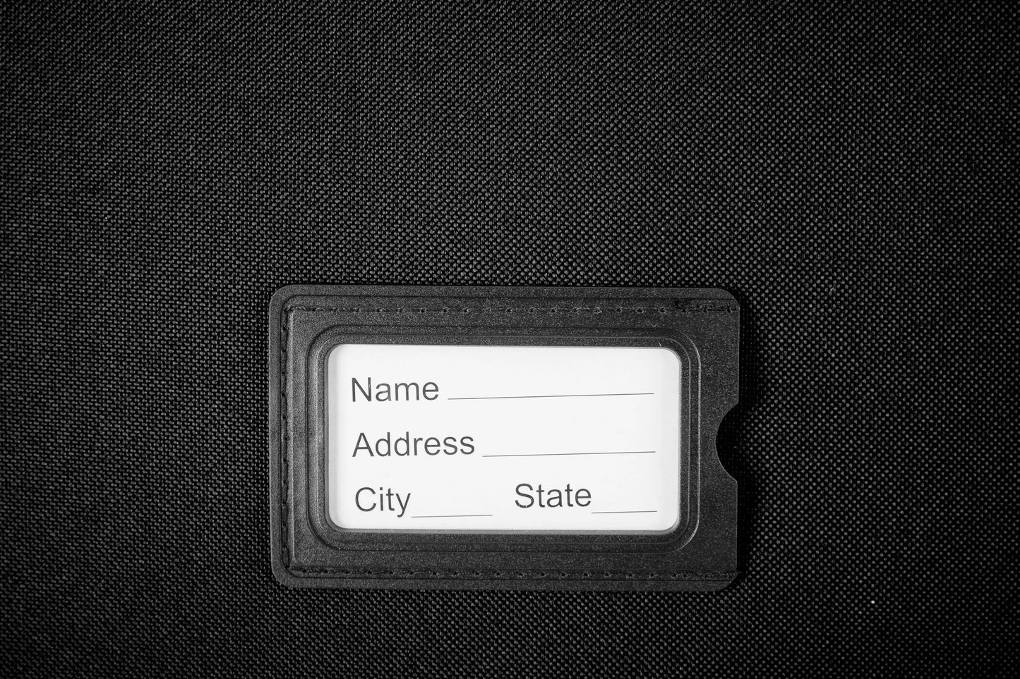 Large Suitcase address tag in DK 16 Orivo Black on white background