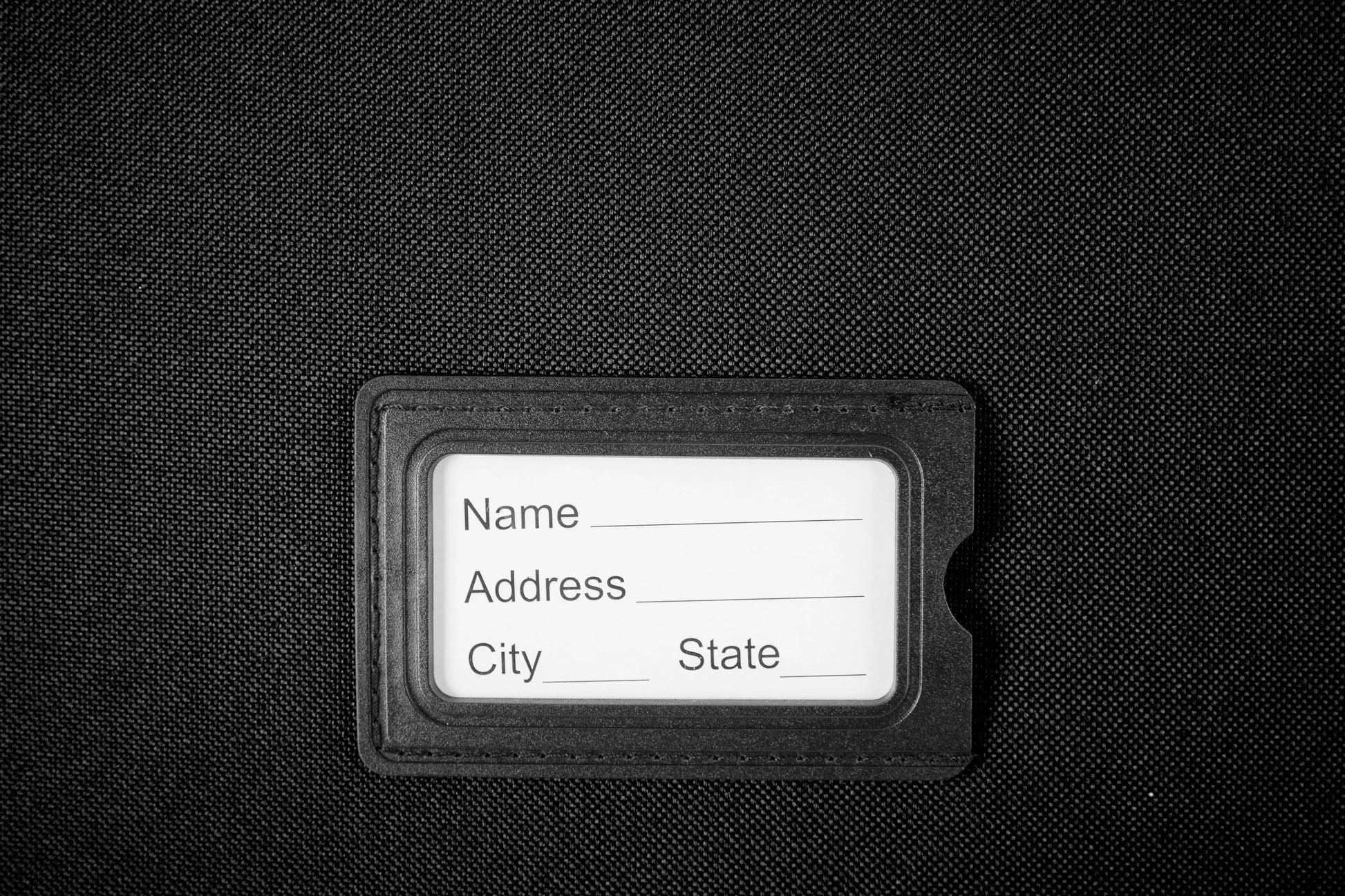 Large Suitcase address tag in DK 16 Orivo Black on white background